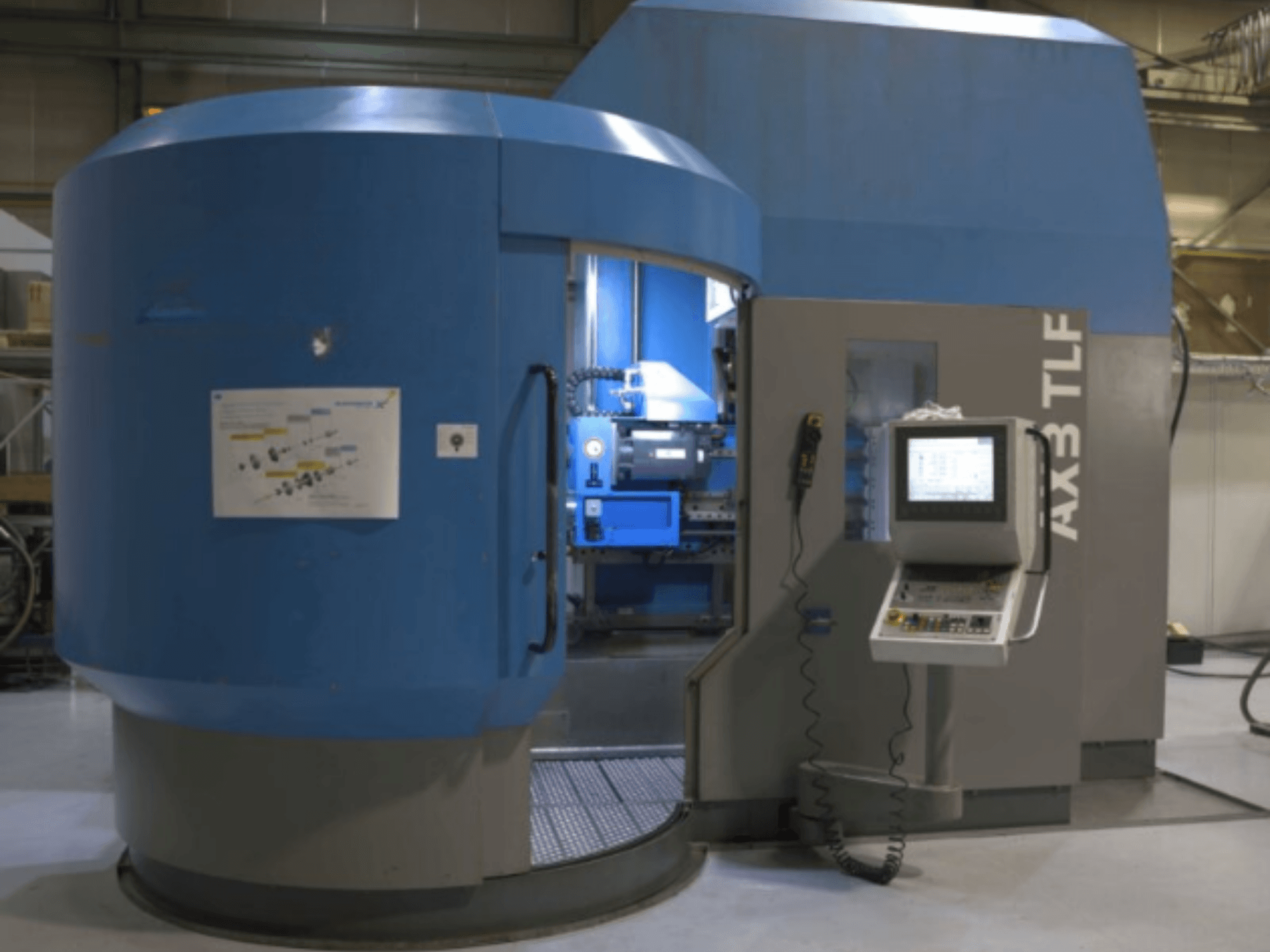 IXION Auerbach IA2 TLF-1200.4 fúrógép elölnézetben; vezérlőpanel és kék burkolat.